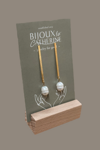 A pair of gold-filled pearl bar posts displayed on a card with the brand name 'Bijoux' 